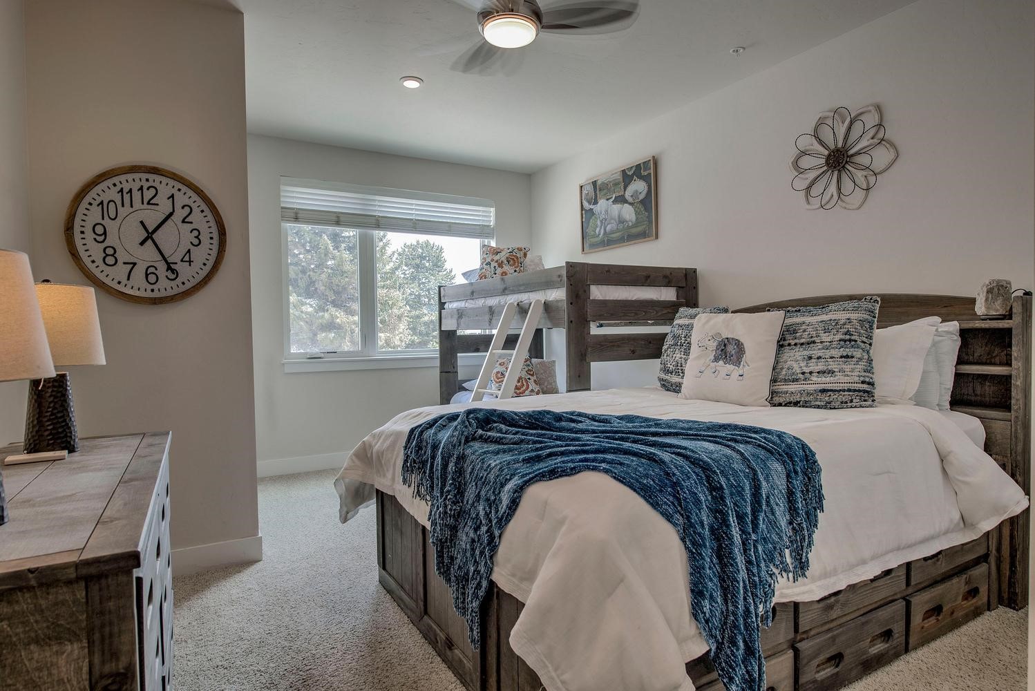235 La Bonte Street, Unit 108 Dillon, CO 80435 - Photo 26 of 38 a bedroom with a bed a clock on the wall and a window