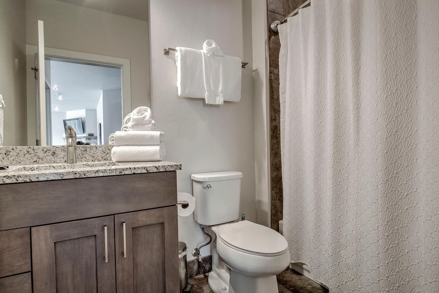 235 La Bonte Street, Unit 108 Dillon, CO 80435 - Photo 30 of 38 a bathroom with a granite countertop sink toilet and shower