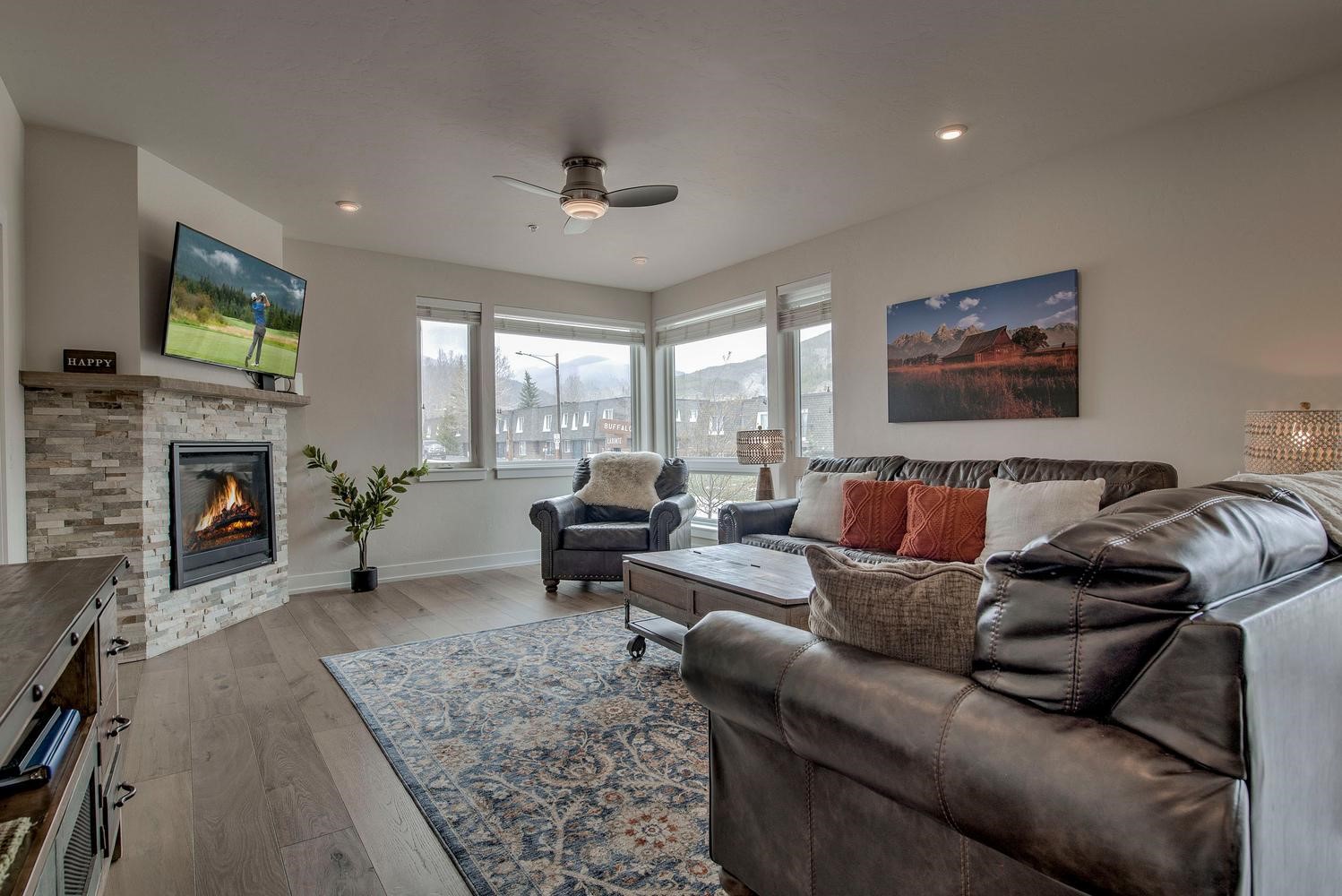 235 La Bonte Street, Unit 108 Dillon, CO 80435 - Photo 3 of 38 a living room with furniture a fireplace and a flat screen tv