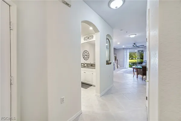 a view of a hallway with dining area and hallway