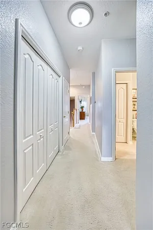 a view of a livingroom with wooden floor and entryway
