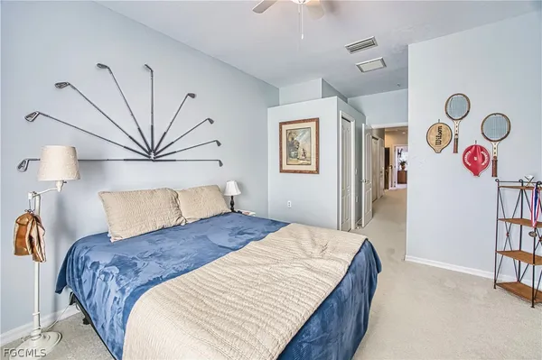 a bedroom with a bed and a book shelf