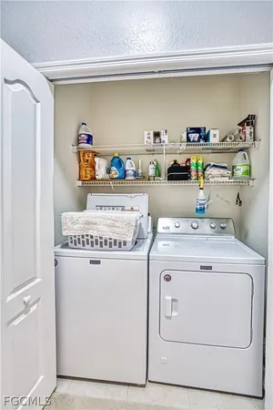 a utility room with washer and dryer