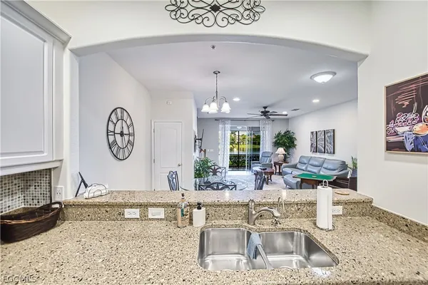 a living room with fireplace furniture and a wooden floor