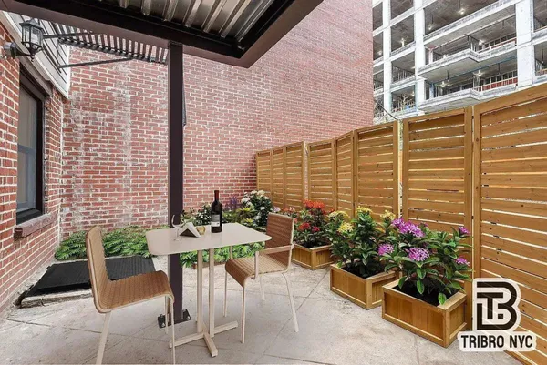 a table and chairs in front of a house