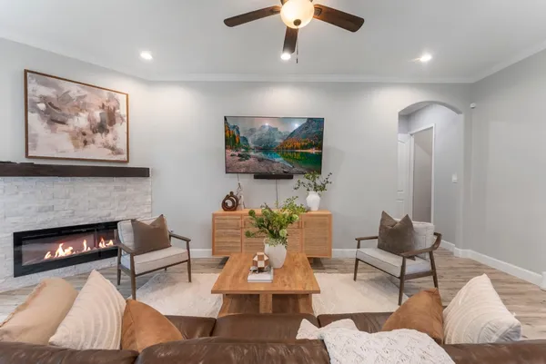 a living room with furniture and a fireplace