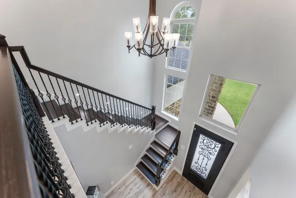 a view of stairs with wooden floor