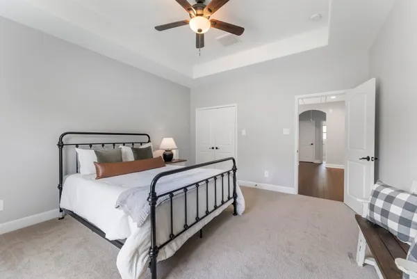 a bedroom with a bed and window