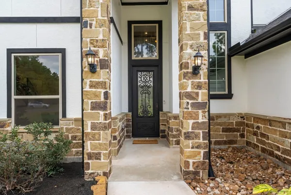a front view of a house with a blue gate
