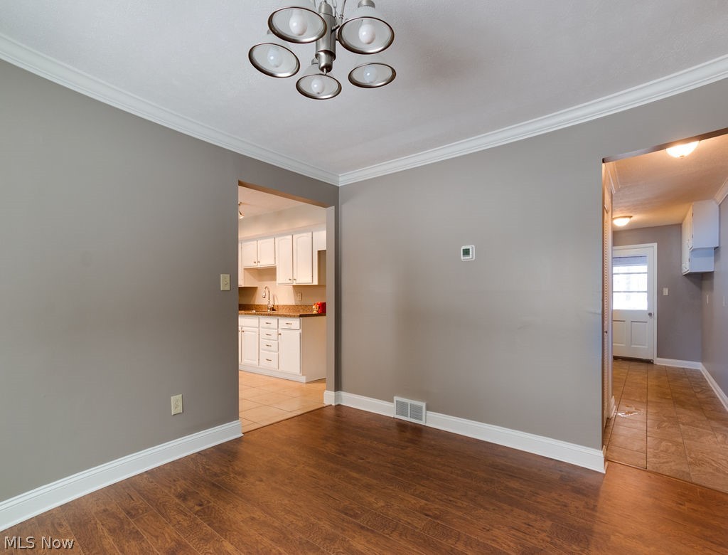 12529 Pearl Road Chardon, OH 44024 - Photo 7 of 33 ANother picture of the Dining Room showing proximity to the Kitchen and the door shoring on the right is the laundry area and another full bath...New Furnace and Air Conditioning installed Dec 2018. New Hot Water Heater too!