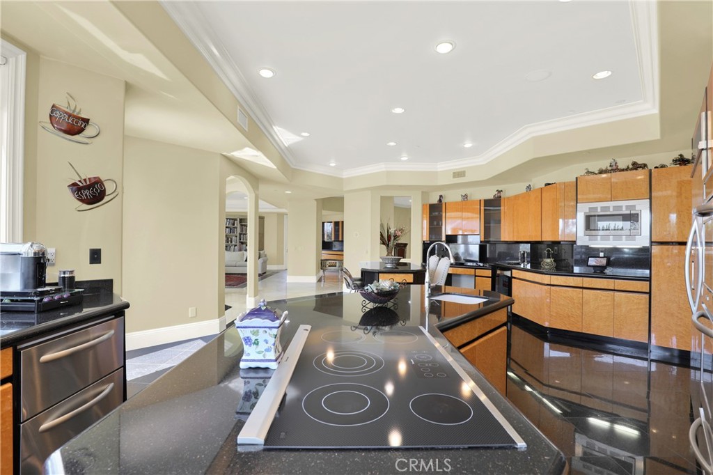 7231 Brandon Court Riverside, CA 92506 - Photo 16 of 69 a view of a living room and kitchen with stainless steel appliances granite countertop lots of counter top space