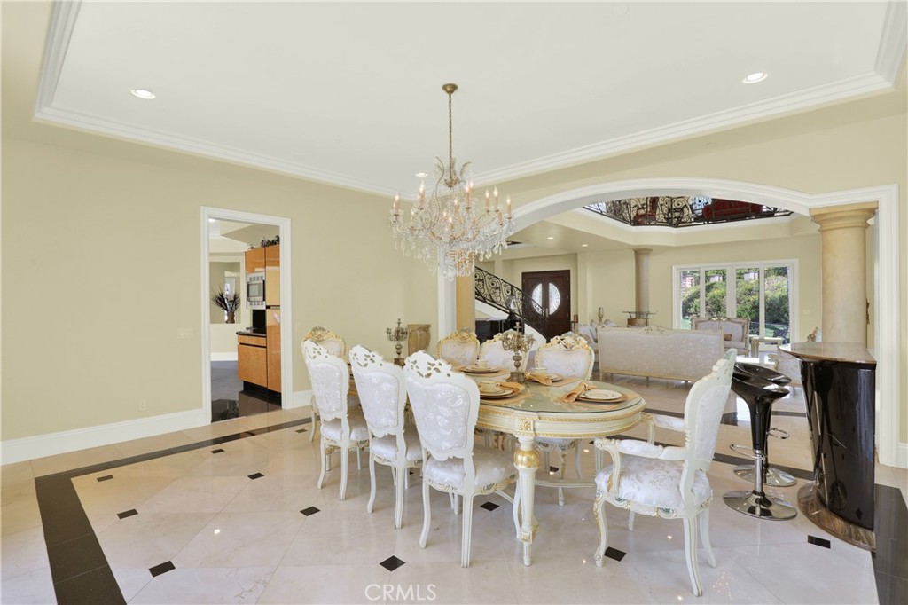 7231 Brandon Court Riverside, CA 92506 - Photo 20 of 69 a view of a dining room with furniture and chandelier