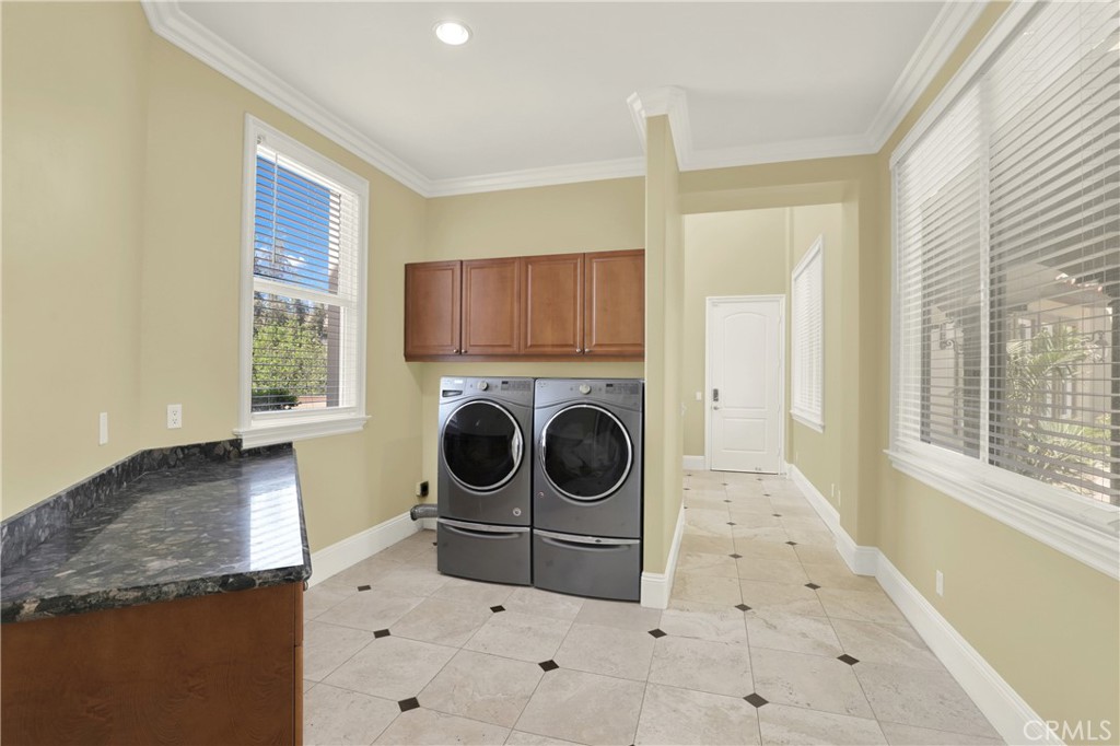 7231 Brandon Court Riverside, CA 92506 - Photo 26 of 69 a utility room with sink dryer and washer