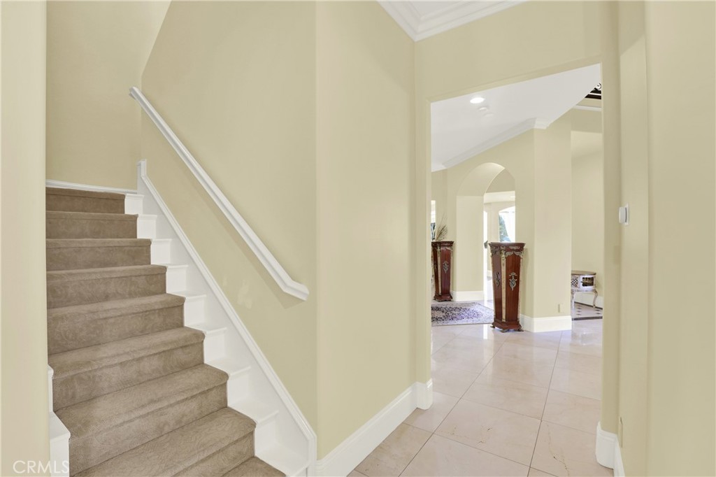 7231 Brandon Court Riverside, CA 92506 - Photo 28 of 69 a view of a hallway with wooden floor and staircase