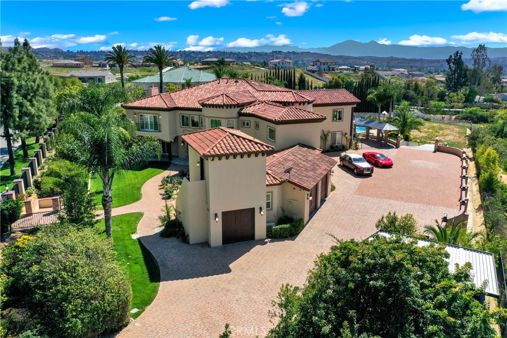 7231 Brandon Court Riverside, CA 92506 - Photo 3 of 69 a view of a patio with table and chairs potted plants with floor to ceiling window and potted plants