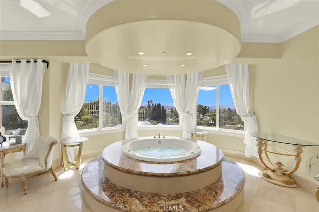 a view of a patio with table and chairs under an umbrella
