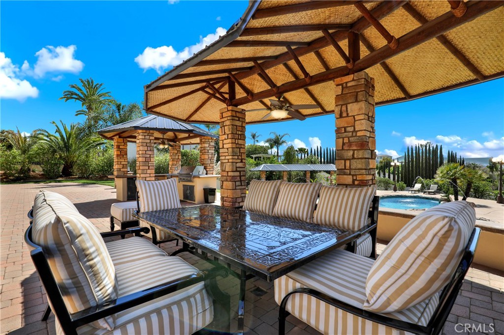 7231 Brandon Court Riverside, CA 92506 - Photo 63 of 69 a view of a patio with a table and chairs