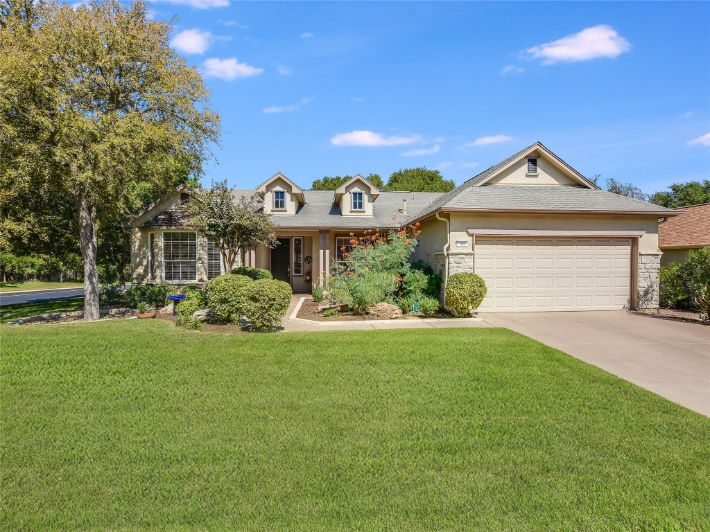 100 Nolan Drive Georgetown, TX 78633 - Photo 1 of 1 a front view of a house with garden