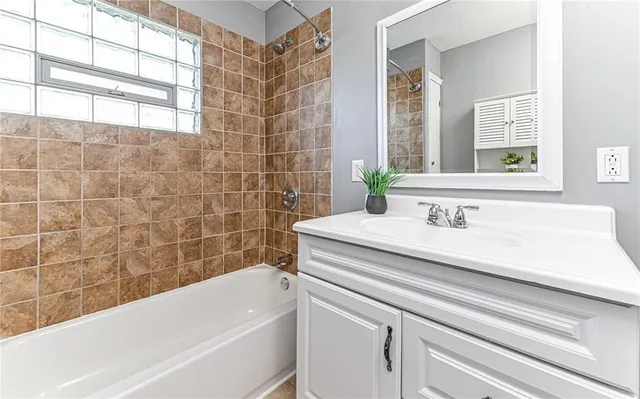 a bathroom with a sink and a bathtub
