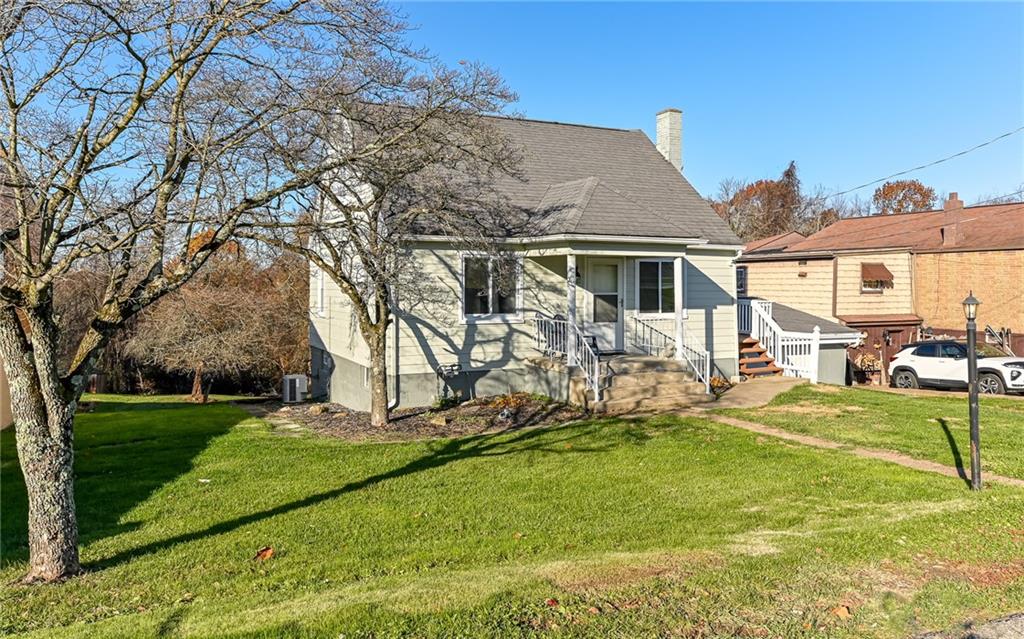 1711 Mercer Street Aliquippa, PA 15001 - Photo 18 of 23 a view of a house with a yard patio and fire pit