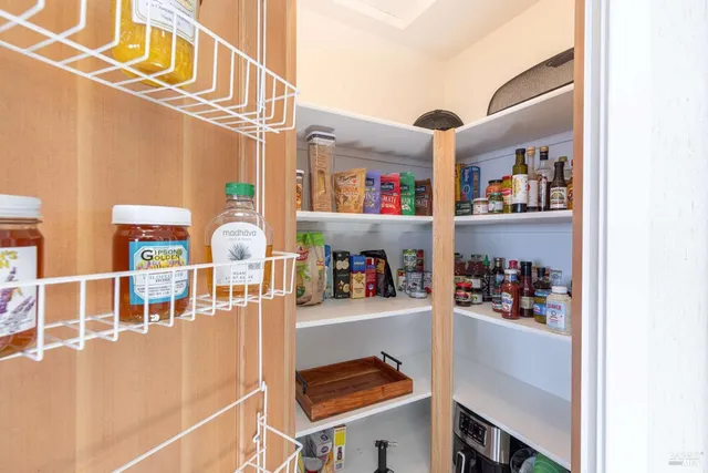 a view of a patio with table and chairs