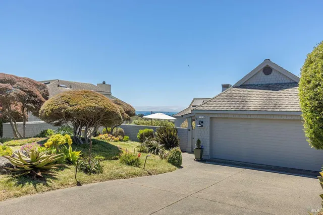 a bathroom with a bathtub and next to a window