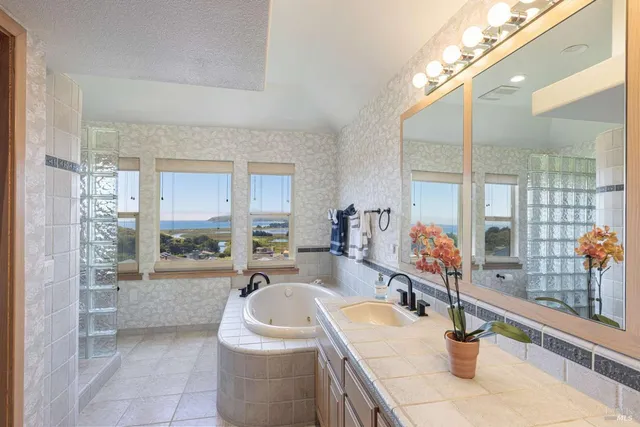 an aerial view of a residential houses with outdoor space