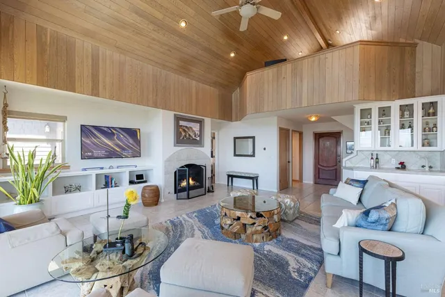 a kitchen with a stove a sink and cabinets