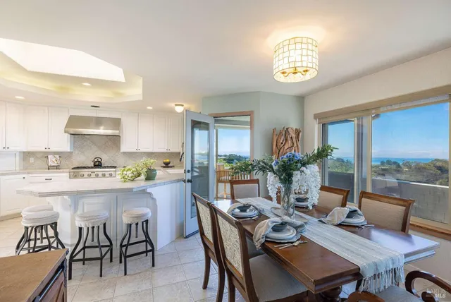 a living room with fireplace furniture and a table