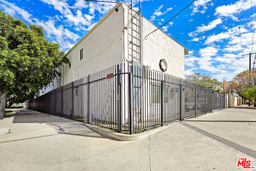 10028 San Fernando Road, Unit 34 Pacoima, CA 91331 - Photo 12 of 16 a view of a entrance gate of a house