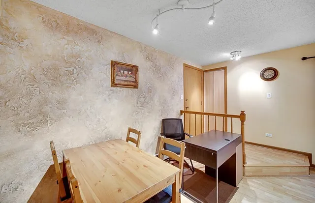 a view of a room with furniture and window