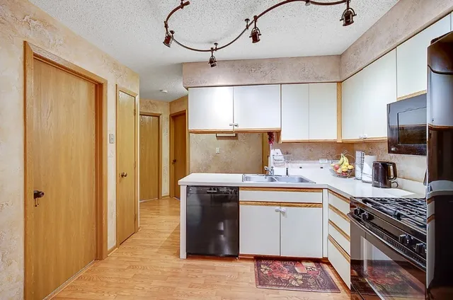 a kitchen with a stove and a refrigerator