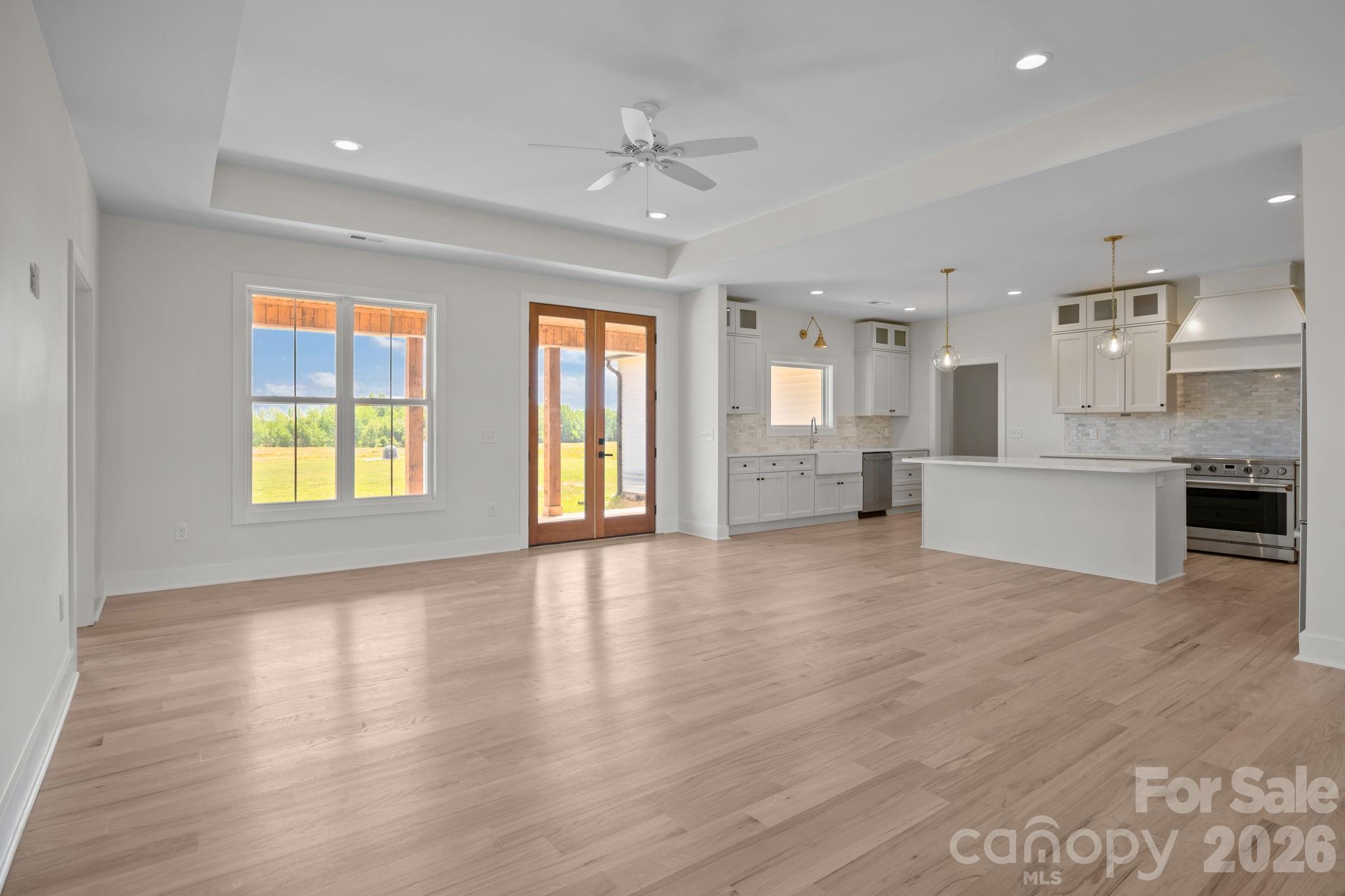 4805 Patterson Road China Grove, NC 28023 - Photo 11 of 42 a view of an empty room with a kitchen and a window