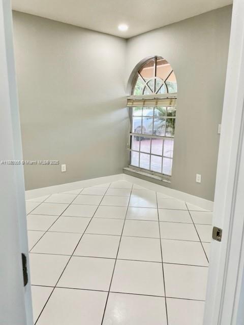 13710 Southwest 36th Street Miami, FL 33175 - Photo 13 of 31 an empty room with window and mirror