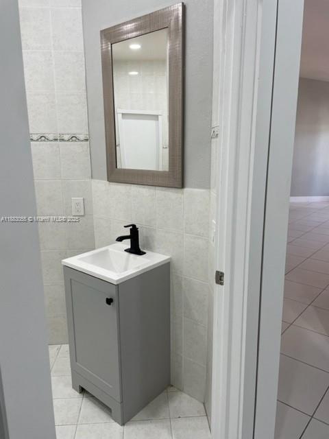 13710 Southwest 36th Street Miami, FL 33175 - Photo 18 of 31 a bathroom with a sink and a mirror