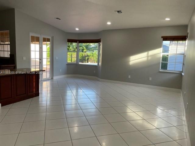 13710 Southwest 36th Street Miami, FL 33175 - Photo 8 of 31 a view of hallway with a window and chandelier