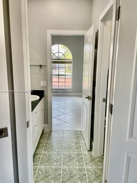 13710 Southwest 36th Street Miami, FL 33175 - Photo 10 of 31 a bathroom with a bathtub and a shower