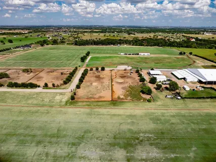 a view of a golf course with a big yard