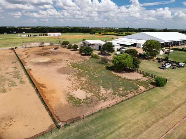 a view of a lake with houses in the back