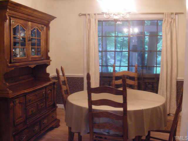7012 Brecken Ridge Avenue Raleigh, NC 27615 - Photo 5 of 6 Intimate formal dining room easily accessed from the formal living room and kitchen. There is a sliding glass door to the covered 12X20' porch.