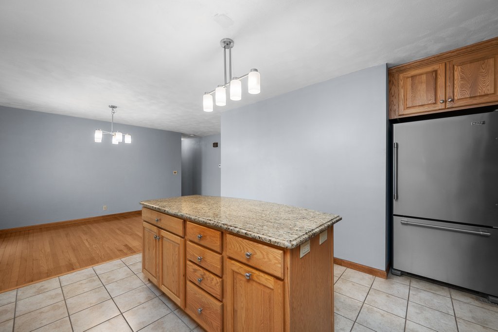207 Amber Lane Geneseo, IL 61254 - Photo 15 of 57 a kitchen with stainless steel appliances granite countertop a refrigerator a oven and a sink with granite countertops