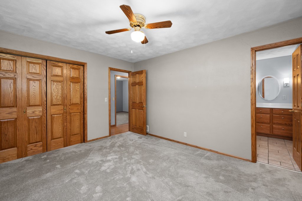 207 Amber Lane Geneseo, IL 61254 - Photo 21 of 57 an empty room with closet and windows