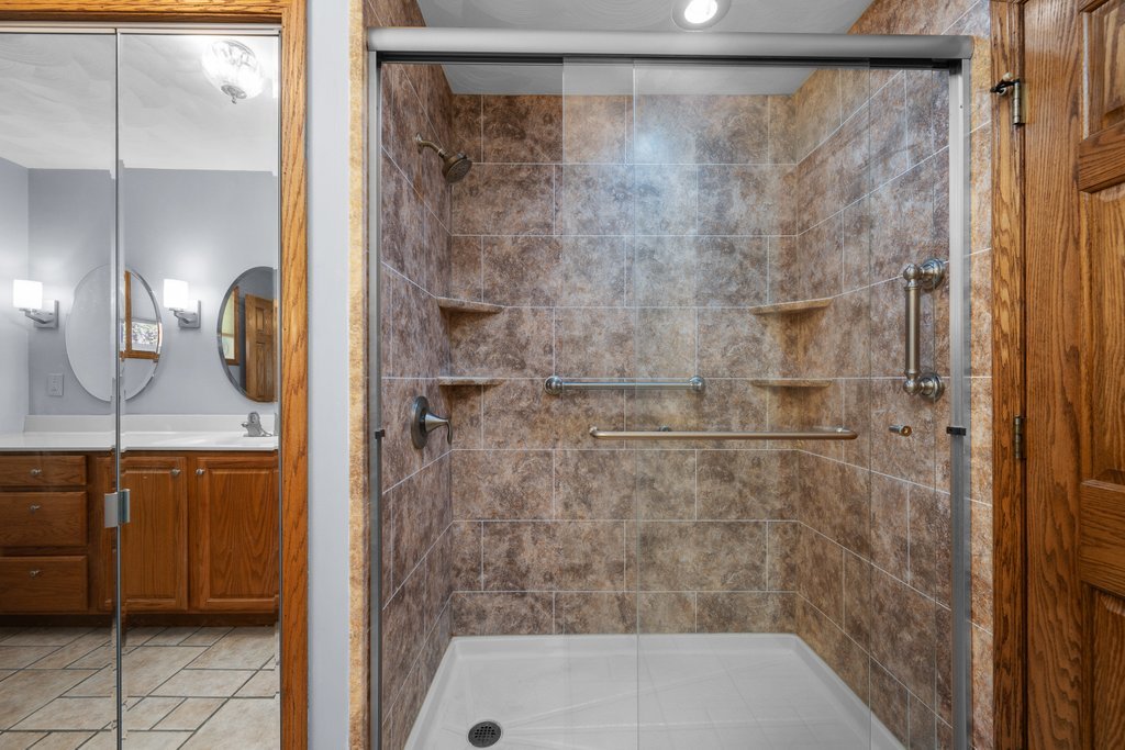 207 Amber Lane Geneseo, IL 61254 - Photo 26 of 57 a bathroom with a shower and a sink