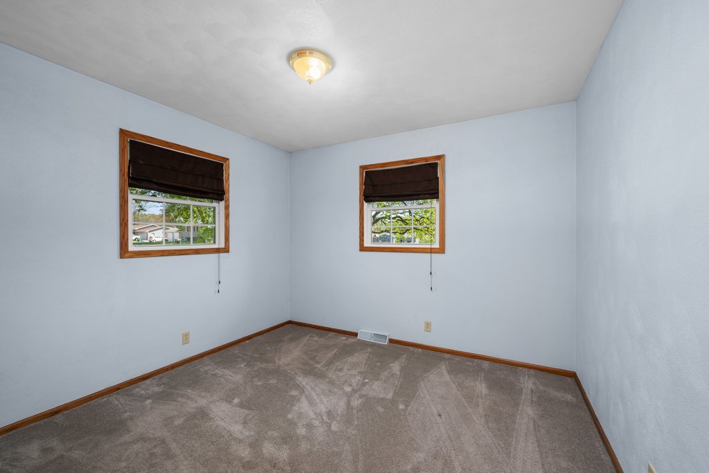 207 Amber Lane Geneseo, IL 61254 - Photo 29 of 57 an empty room with windows