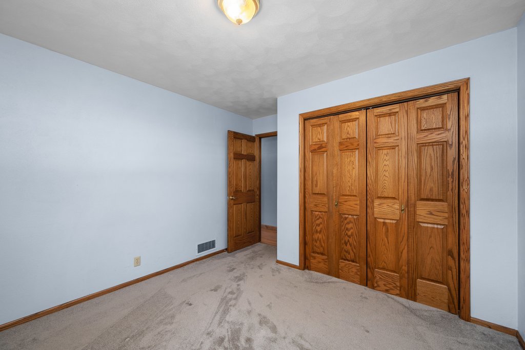 207 Amber Lane Geneseo, IL 61254 - Photo 30 of 57 an empty room with closet area