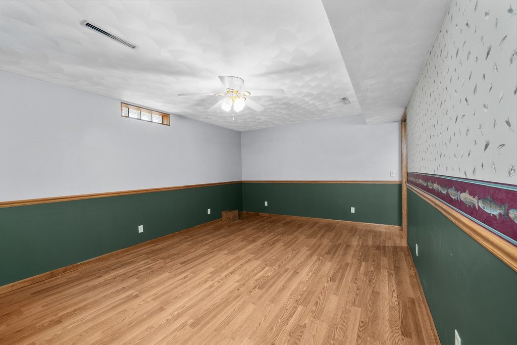 207 Amber Lane Geneseo, IL 61254 - Photo 39 of 57 a view of a room with a ceiling fan and wooden floor
