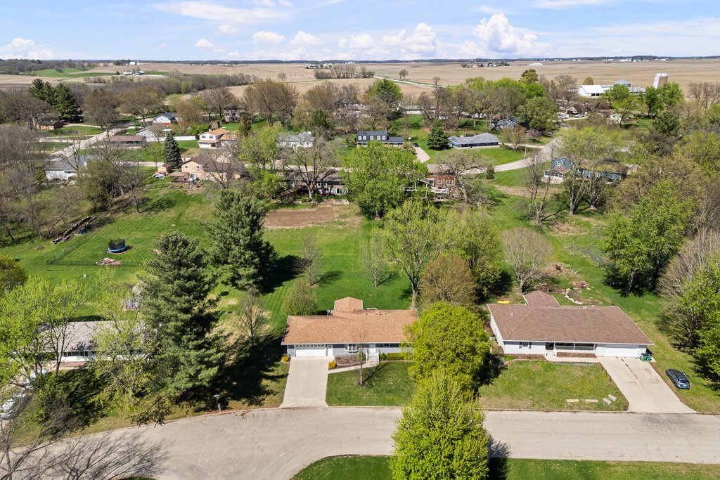 207 Amber Lane Geneseo, IL 61254 - Photo 4 of 57 an aerial view of residential houses with outdoor space and lake view