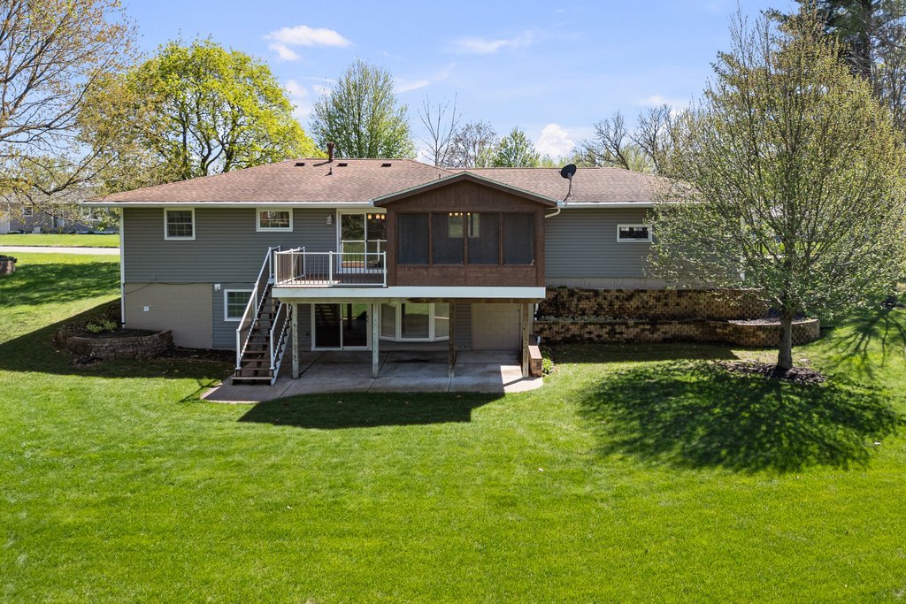 207 Amber Lane Geneseo, IL 61254 - Photo 52 of 57 a front view of a house with a yard