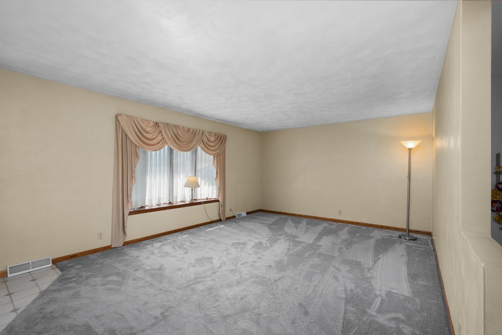 207 Amber Lane Geneseo, IL 61254 - Photo 6 of 57 a view of an empty room with a window