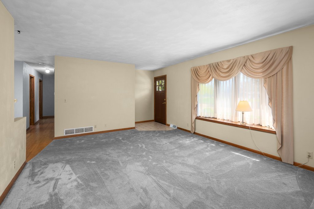 207 Amber Lane Geneseo, IL 61254 - Photo 7 of 57 a view of an empty room with a window